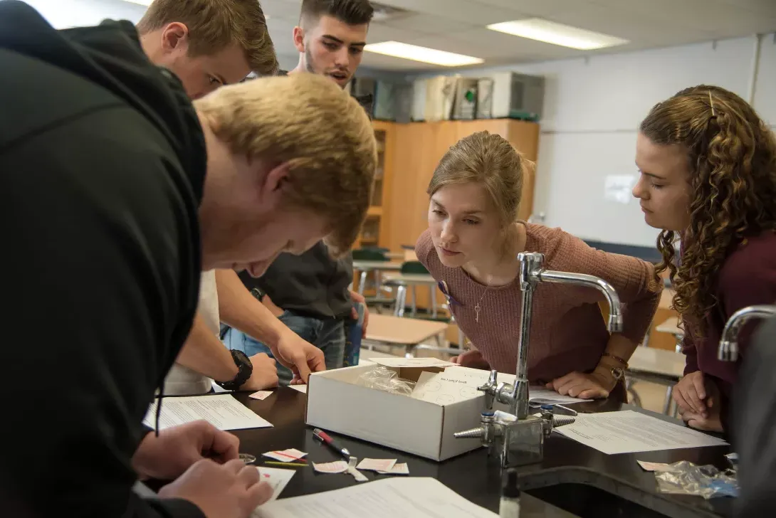 student teacher in high school science classroom