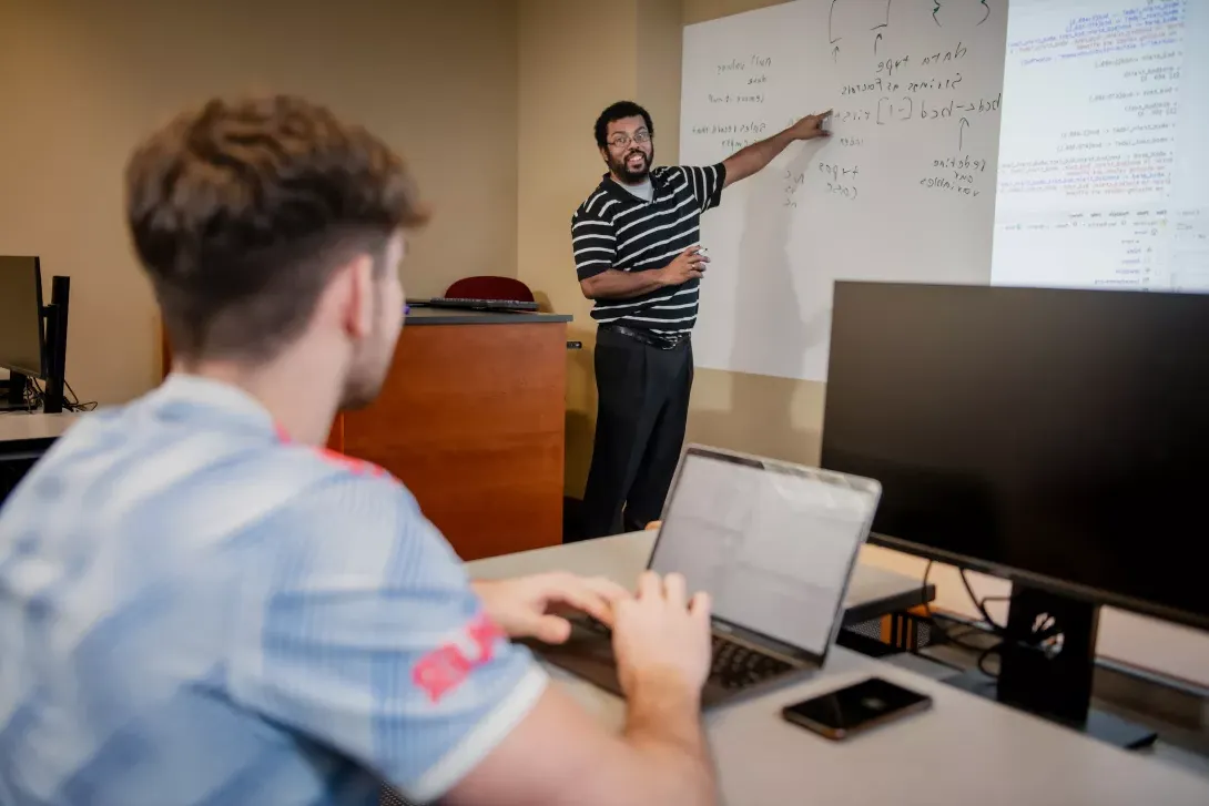 professor teaching to student 